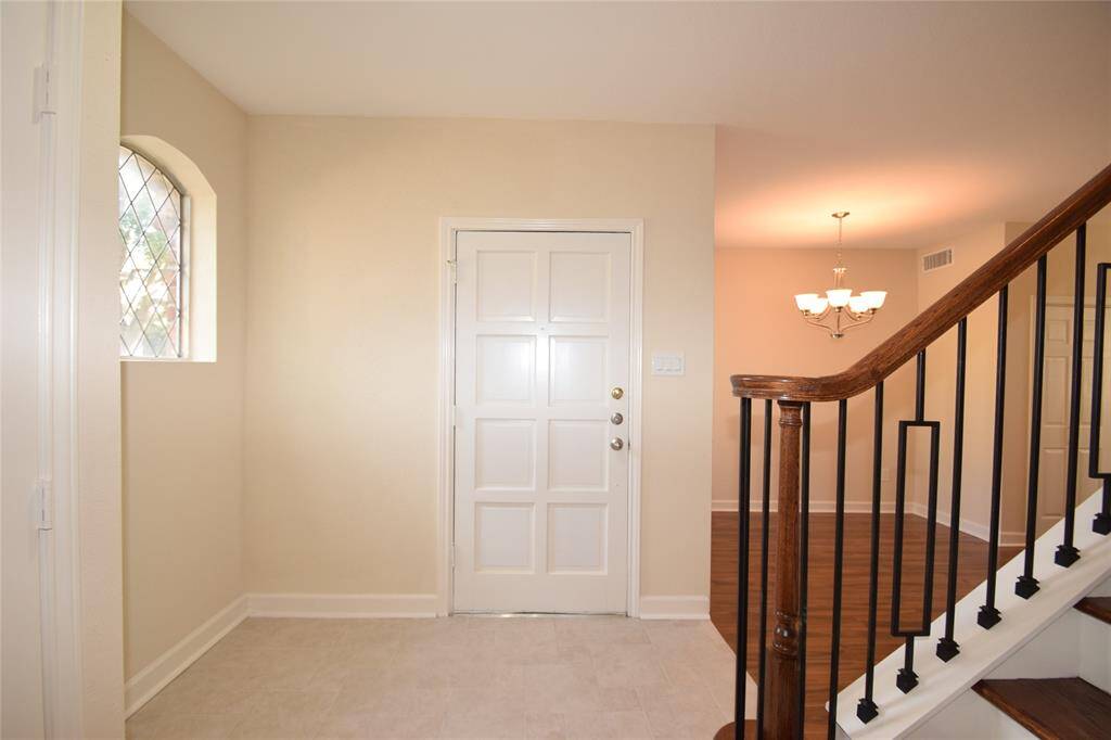 Enjoy another entry view opening to the living room and dining room.