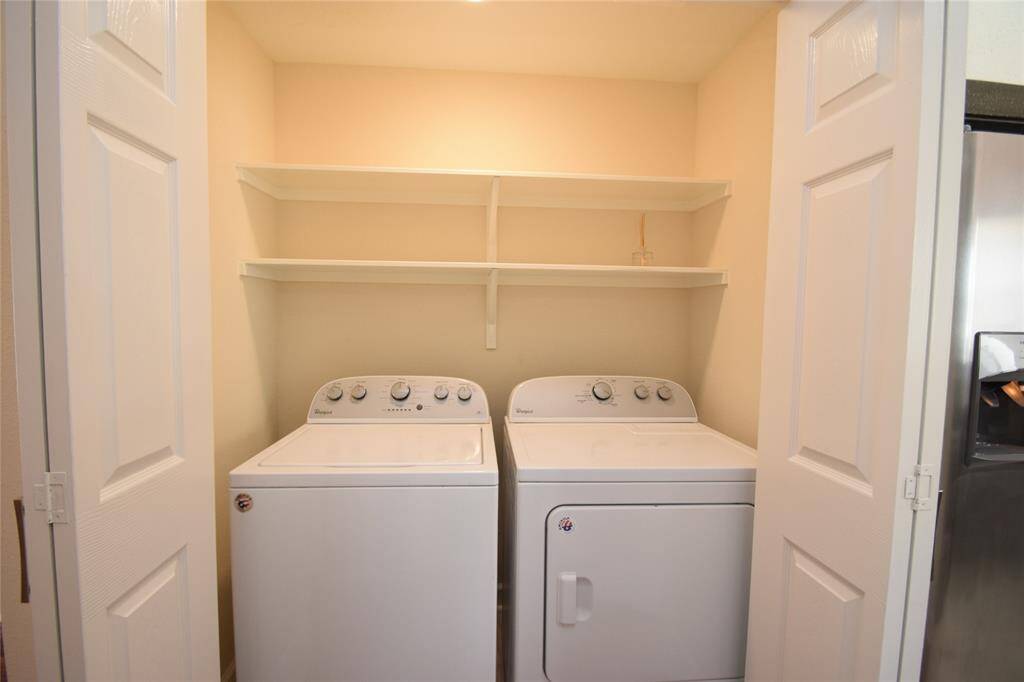 Utility closet between the kitchen and dining room.