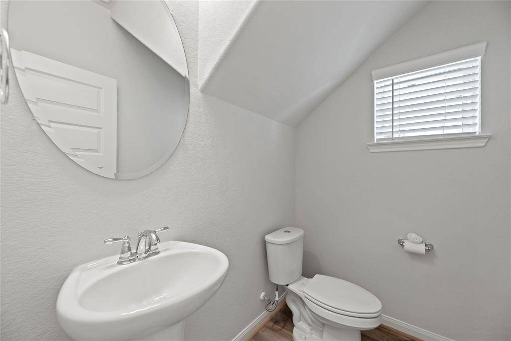Modern half-bathroom on the first floor off of the kitchen.