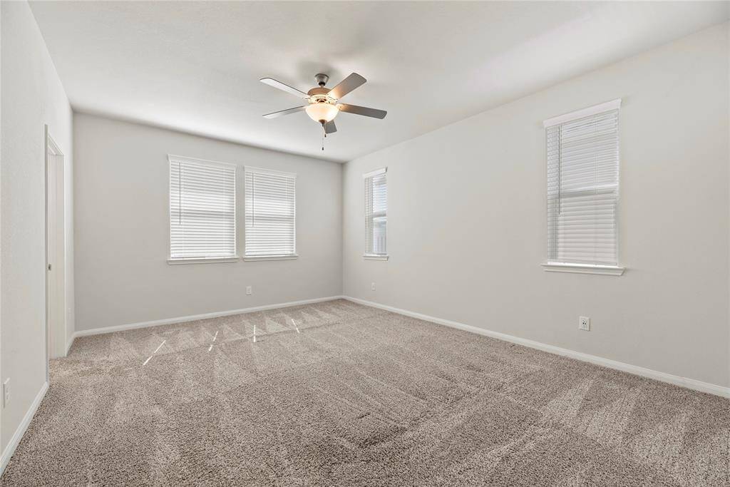 The spacious and bright primary bedroom on the second floor.