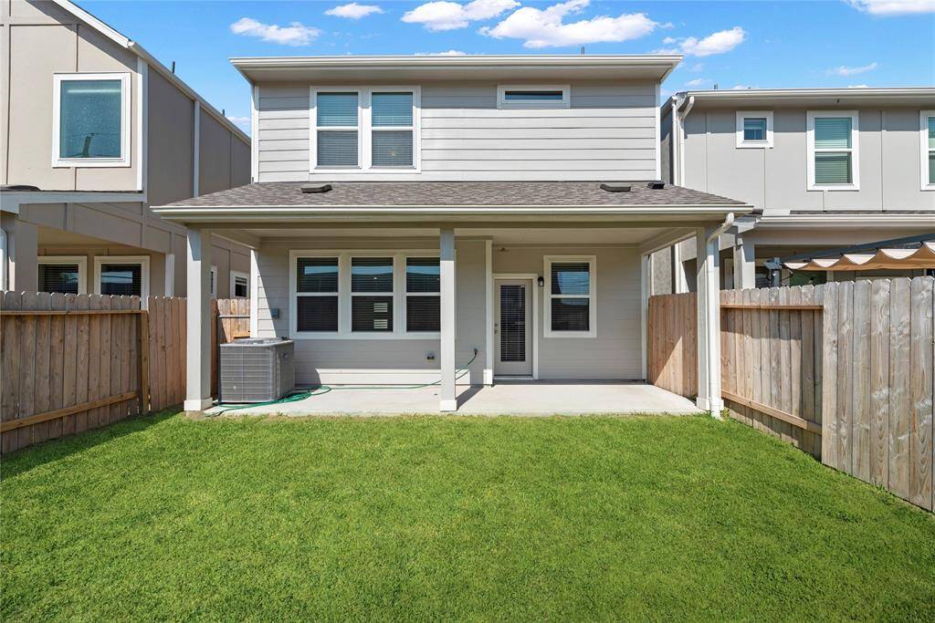 A shot of the covered patio and private backyard.