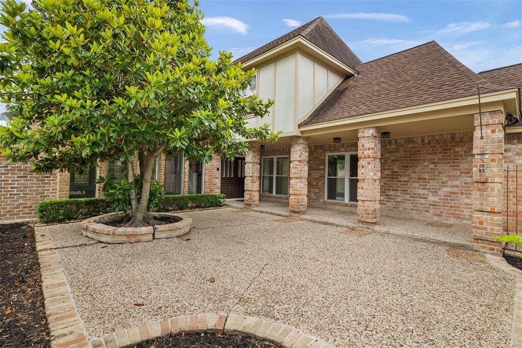 The expansive front patio offers a perfect spot to relax and unwind, providing an inviting outdoor space that enhances the home's curb appeal and adds to its charming, welcoming atmosphere.