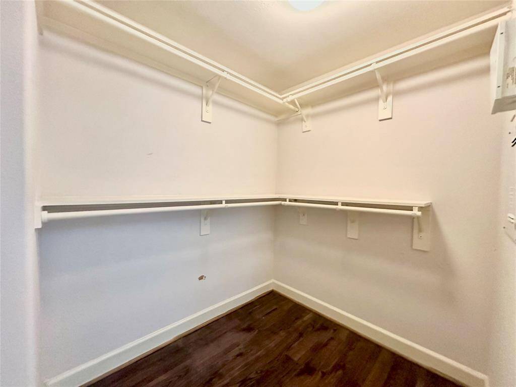Large and clean walk-in closet on second floor next to primary bedroom.