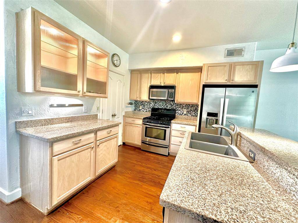 Kitchen has lots of storage and counter space with under cabinet lighting. Appliances are included.
