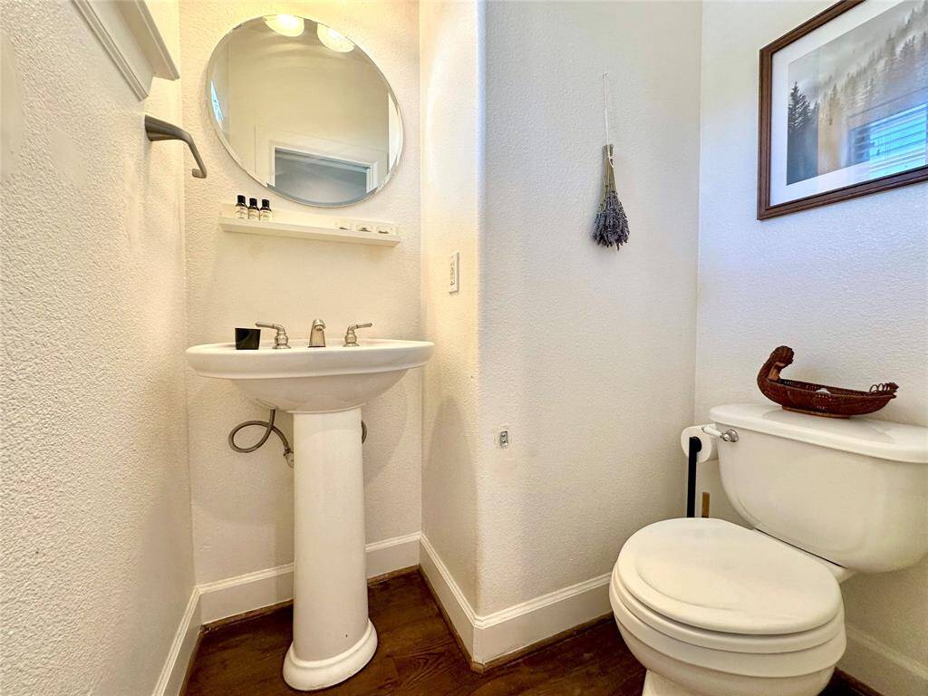 Clean and spacious half-bath located just as you enter the unit from the front door.