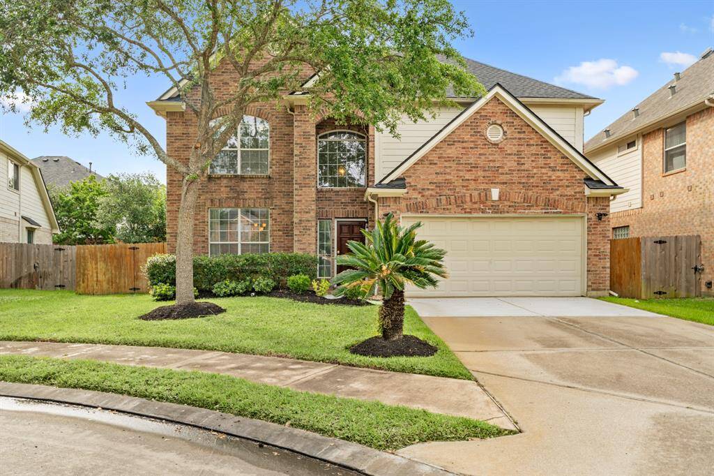 Welcome home! This charming two story home boasts great curb appeal with beautiful lush landscaping and a well-manicured front lawn.
