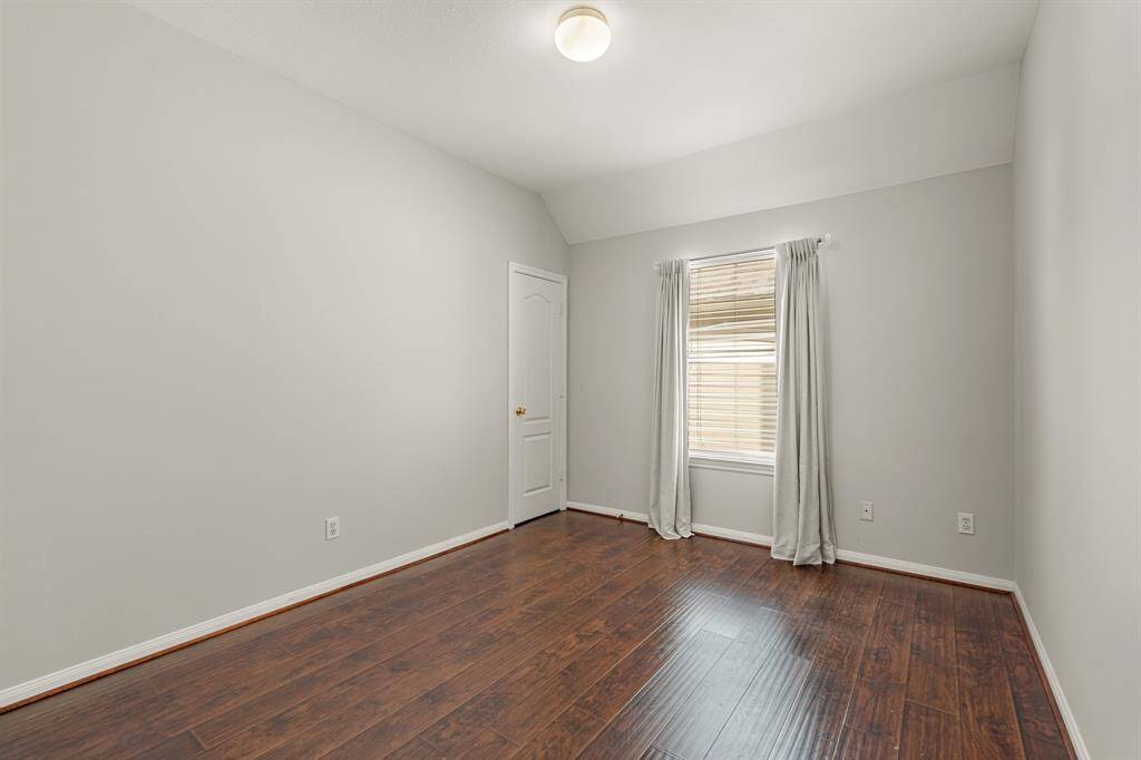 Bright and inviting, this spacious secondary bedroom offers plenty of room for relaxation and personalization, making it the perfect retreat for family or guests.