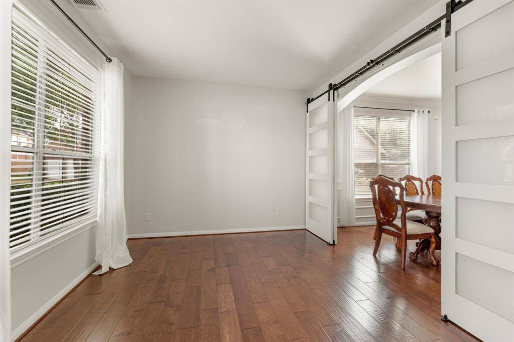Need extra space? This front bonus room is perfect for a home office, play room, or library! It features bright natural light and wood floors