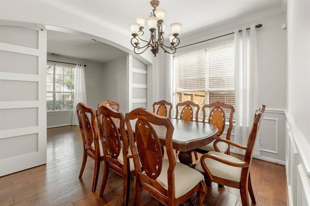 Make memories gathered around the table with your family and friends! This dining room features beautiful moding, a chandelier, and direct access to the kitchen!