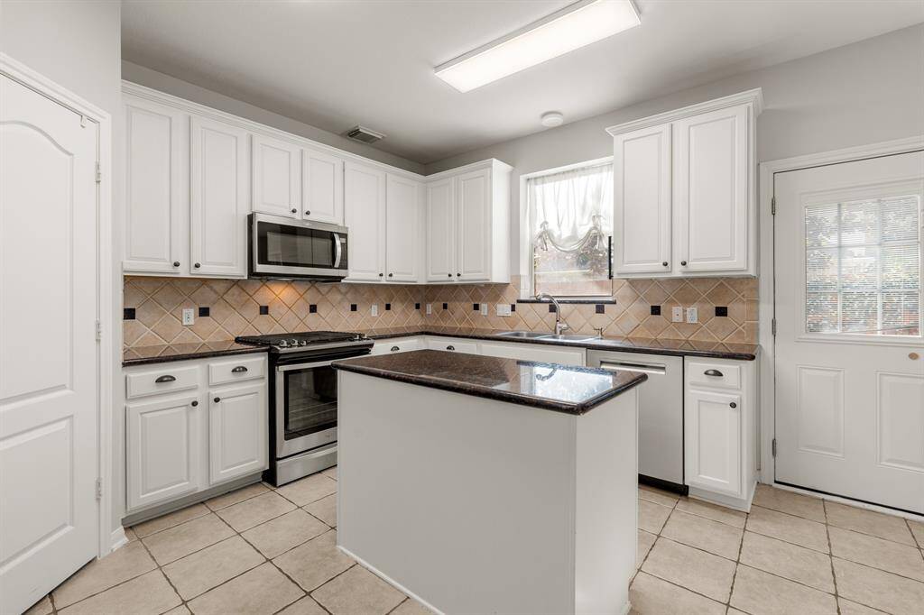There is plenty of storage and counterspace making this kitchen every chef's dream! It directly connects to the back pation, perfect for indoor-outdoor living!
