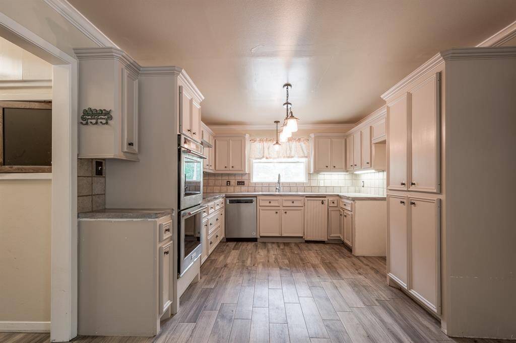 Kitchen has lots of cabinets