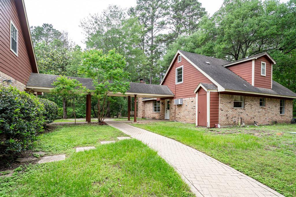 Covered breezeway between house and main garage