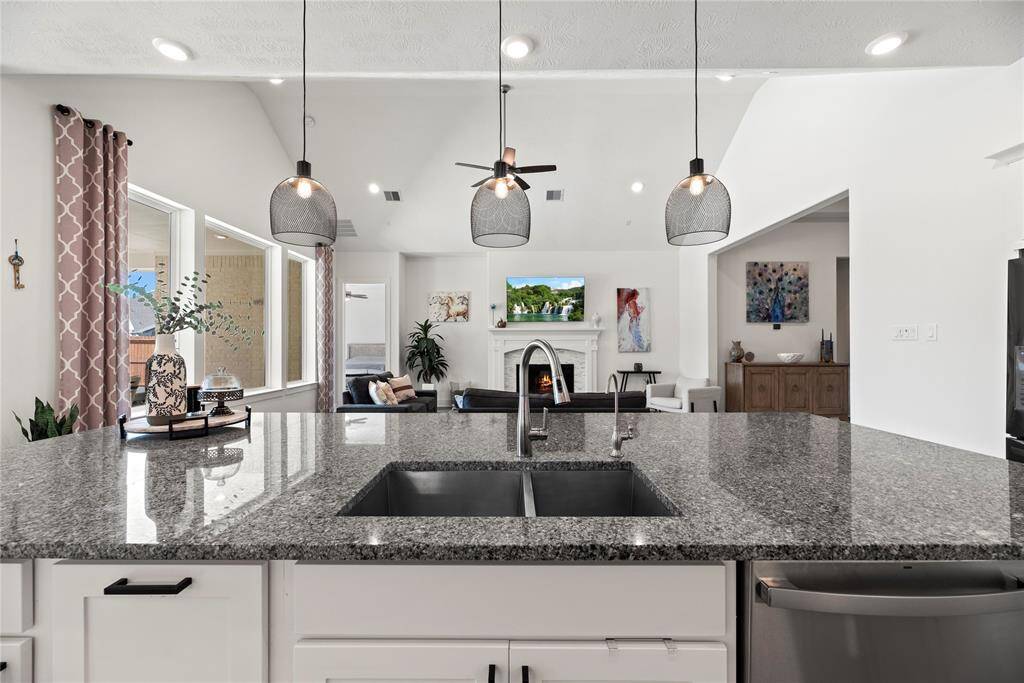 Island kitchen with breakfast bar.