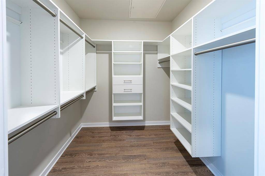 Custom built-in closets in  primary bedroom