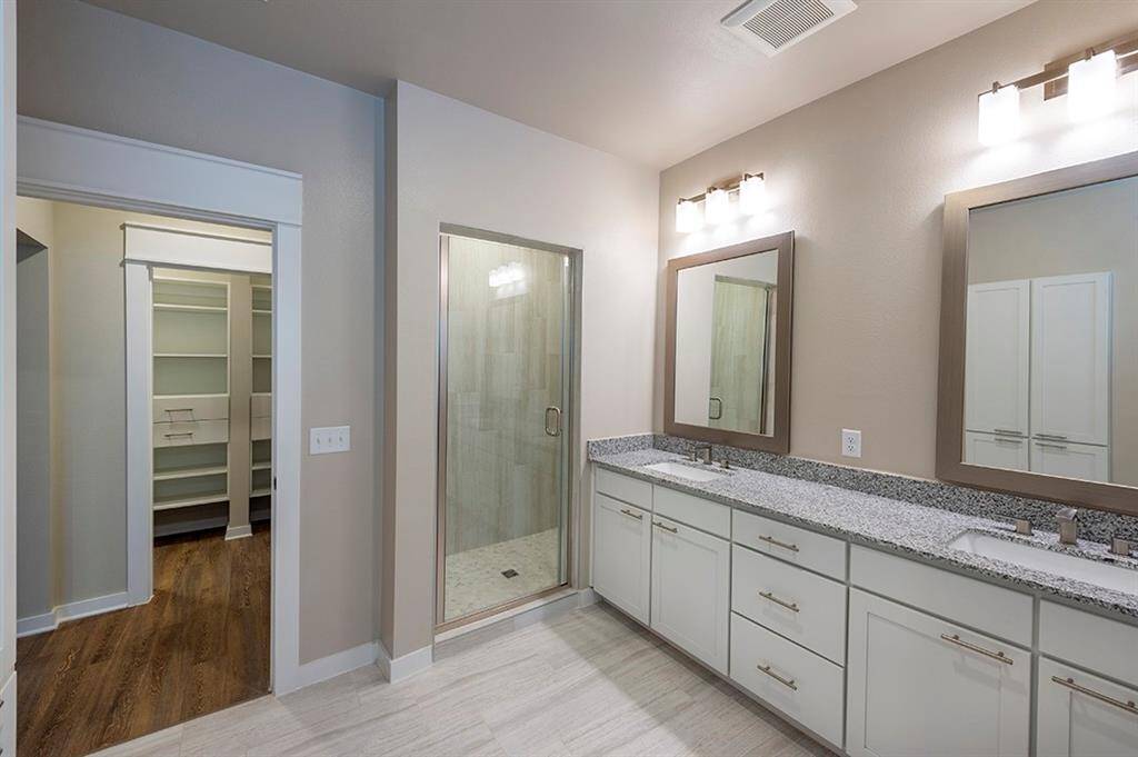 Primary bath with double sinks and separate shower
