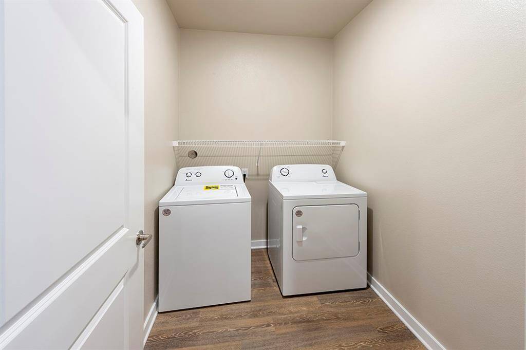 Utility room with full sized washer and dryer