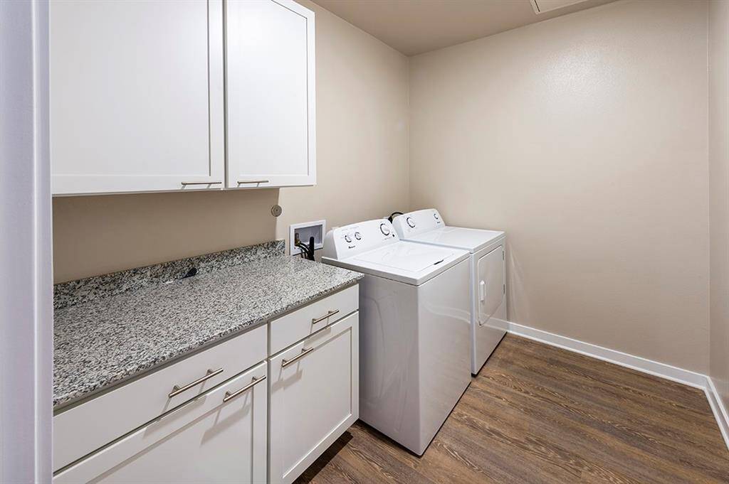 Utility room with full sized washer and dryer