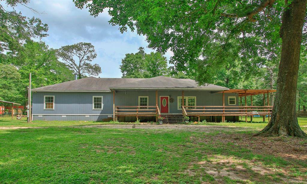 Beautiful home with a large wrap around porch on 2 acres.