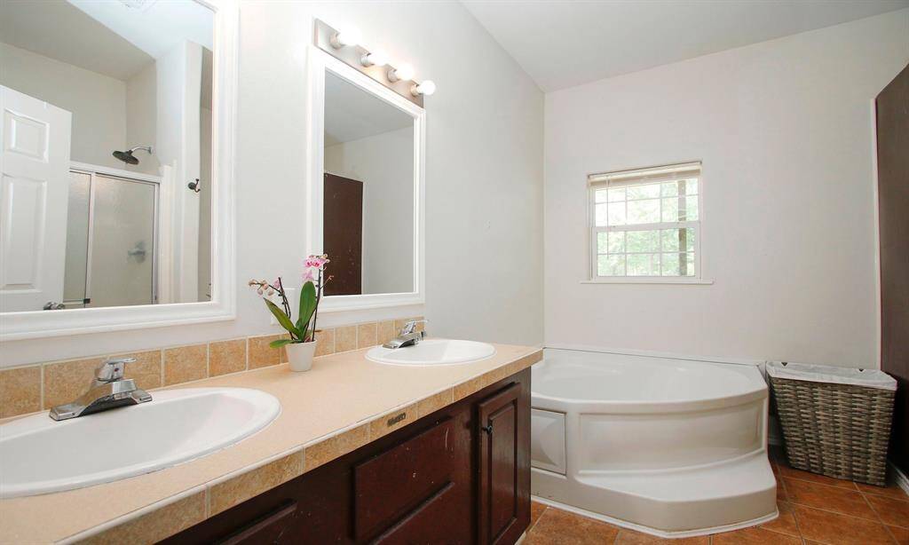 Primary Bathroom with a large soaking tub
