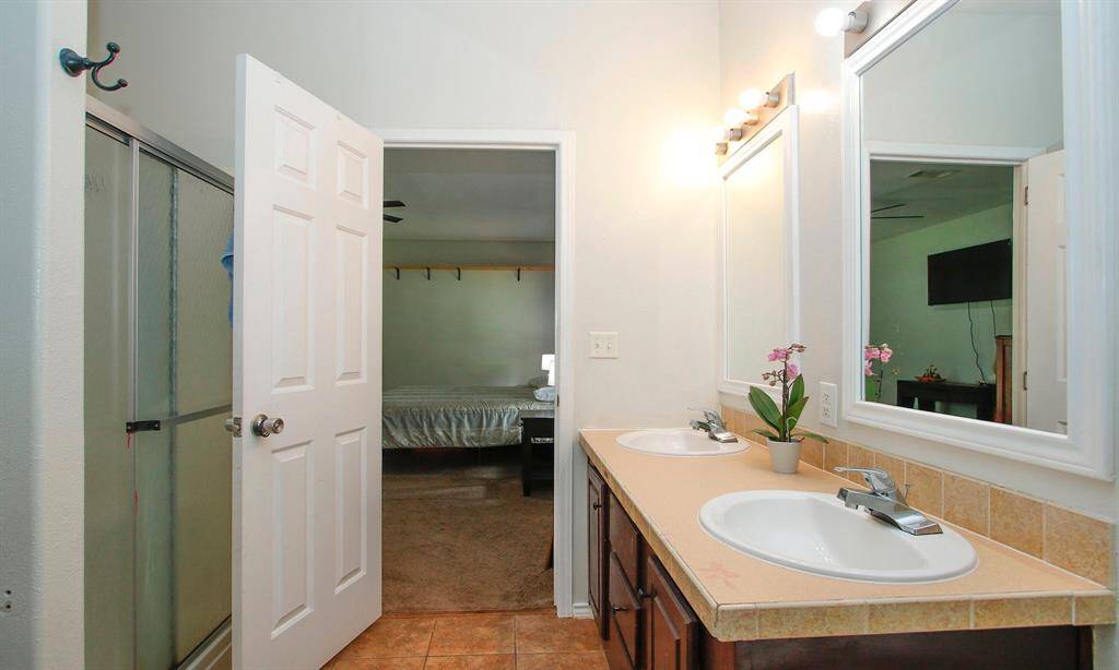 Double sinks and a seperate shower in the primary bathroom