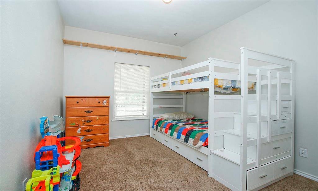 This office/6th bedroom is being used as a bedroom and has wired internet connetions. Located neat the front of the home