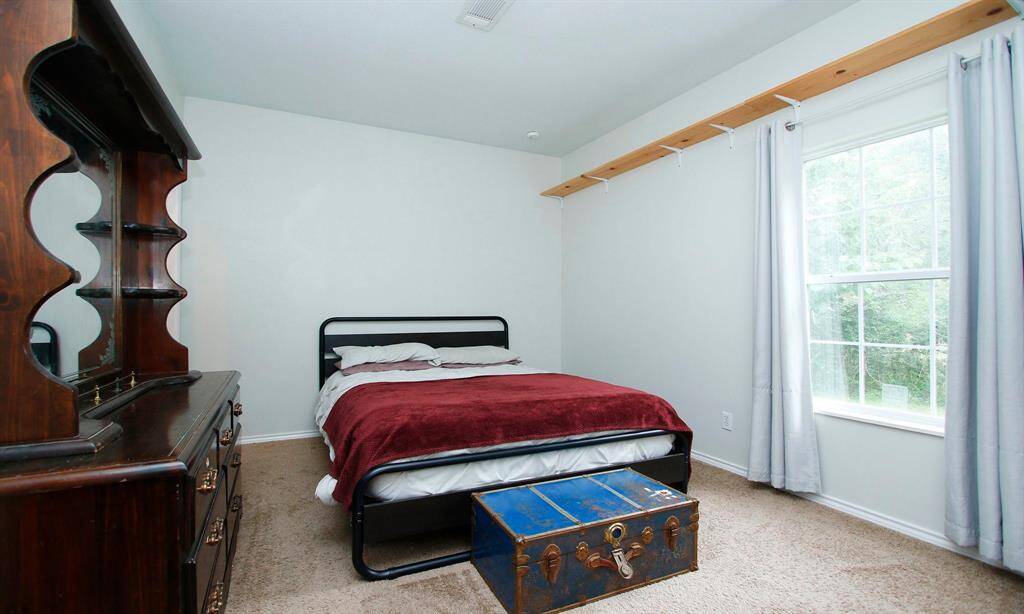 Bedroom 4 near the back of the family room