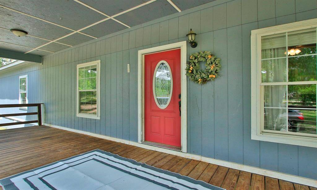 Here is your large front porch with seating room on both sides.