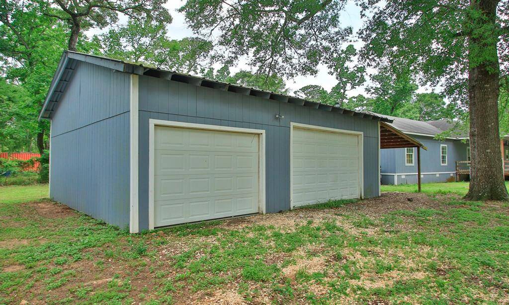 Outside you will find the 3 car garage with a floored attic storage
