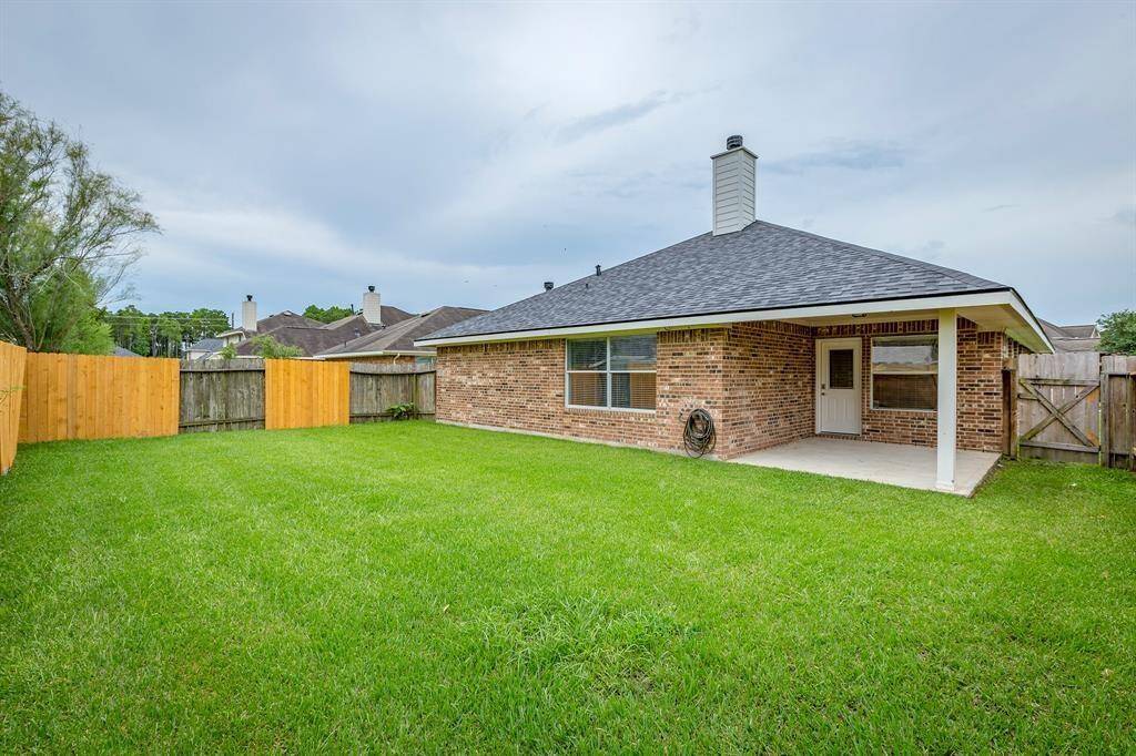 Easy maintenance backyard with a large covered patio!