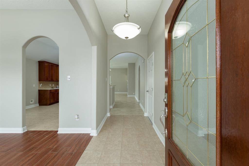 Beautiful 4 bed/2 bath single story with inviting front entry. FRESHLY PAINTED & NO CARPET in this amazing home!