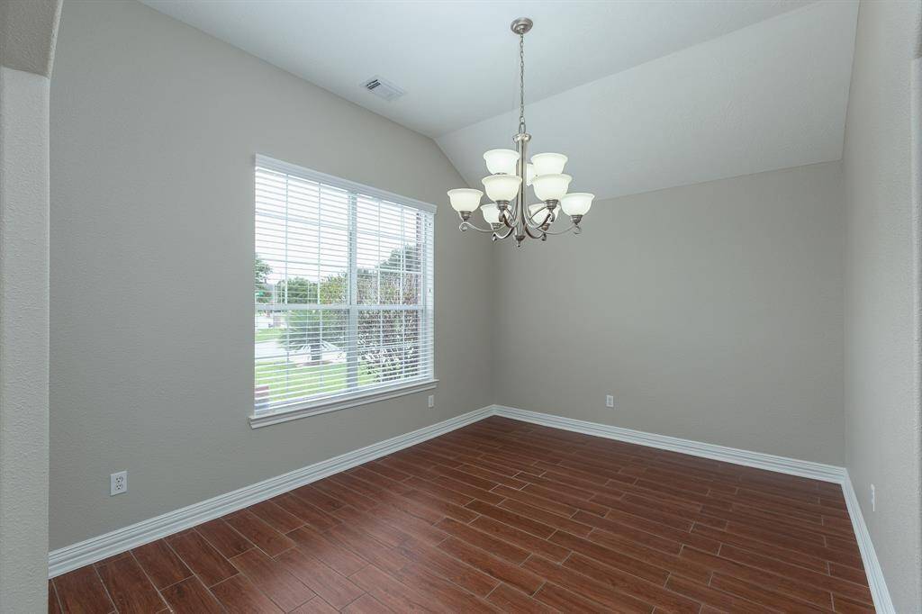 Formal dining with wood-looking tile floor