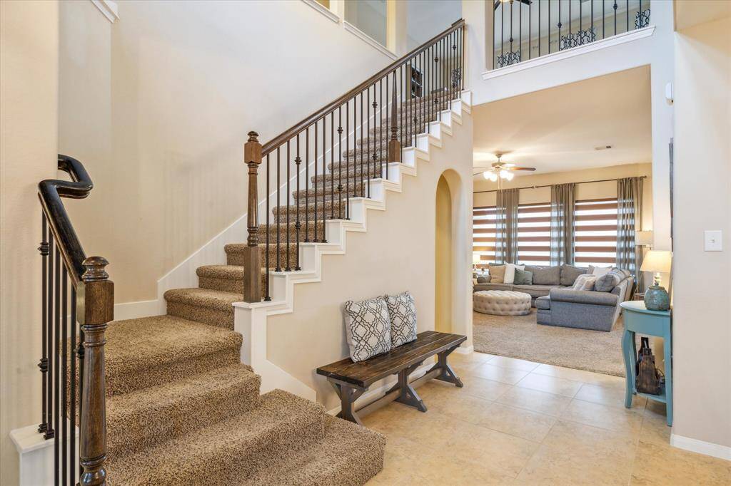 Inviting foyer with staircase leading to the second floor.