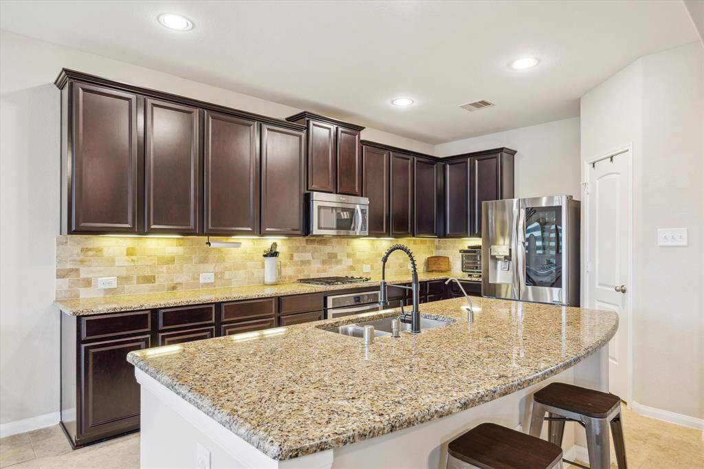 Chef-inspired kitchen, designed with high-end finishes and functionality in mind, perfect for creating culinary masterpieces.