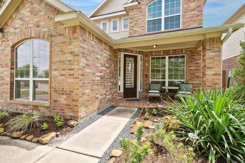 Charming covered front porch welcomes you at the entrance.