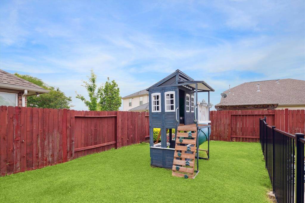 Additional green space in the backyard, providing plenty of room for outdoor activities or gardening.