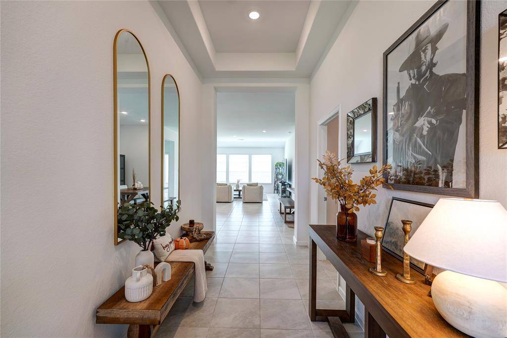 Welcome to your new home!! As you enter you are greeted with 2 tray ceilings with recessed lighting in your beautiful entry that has plenty of space for seating and/or a beautiful entryway table. Let your imagination run wild with decorating this space!
