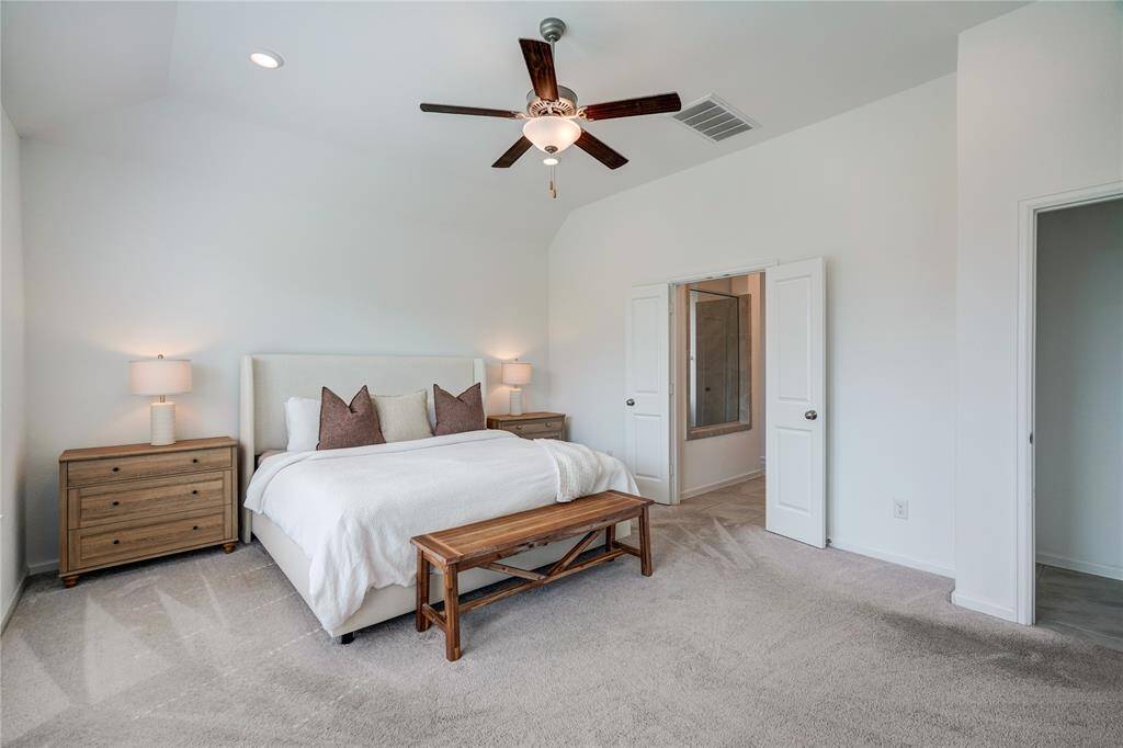 Welcome to your oversized primary retreat! The double French doors lead to you en-suite bathroom.