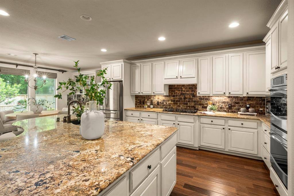 Stainless appliances, large island and gas cook top