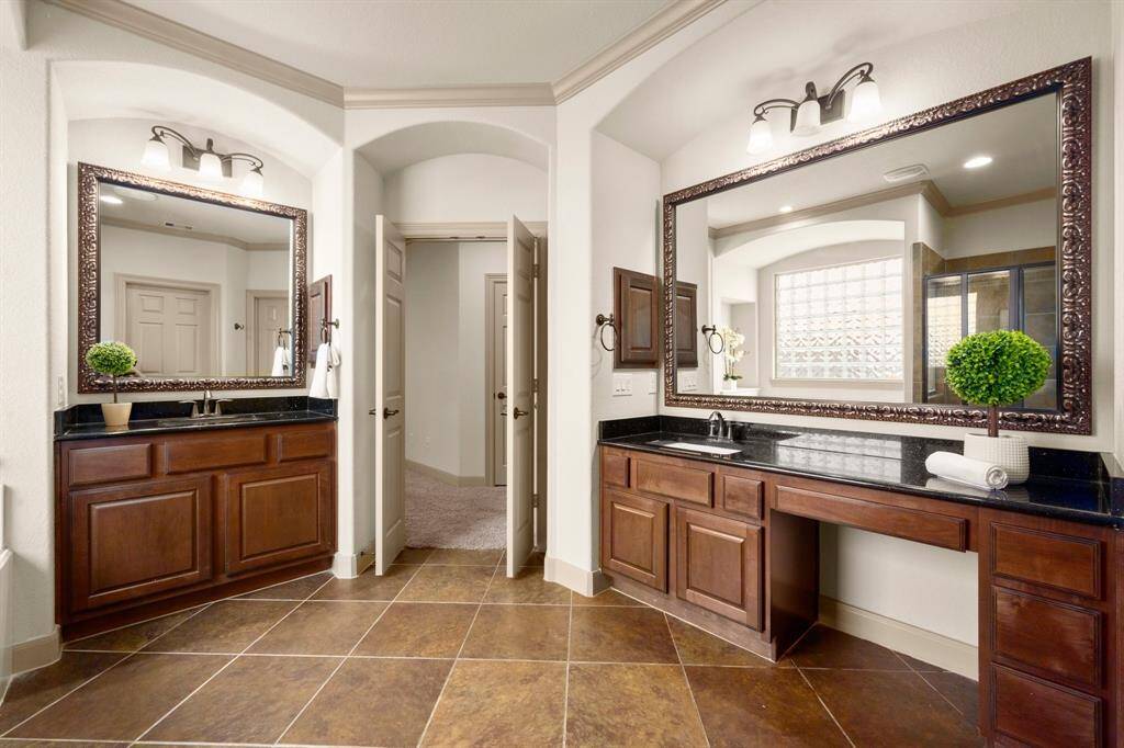 Primary bathroom with dual vanity, jetted tub and seperate shower