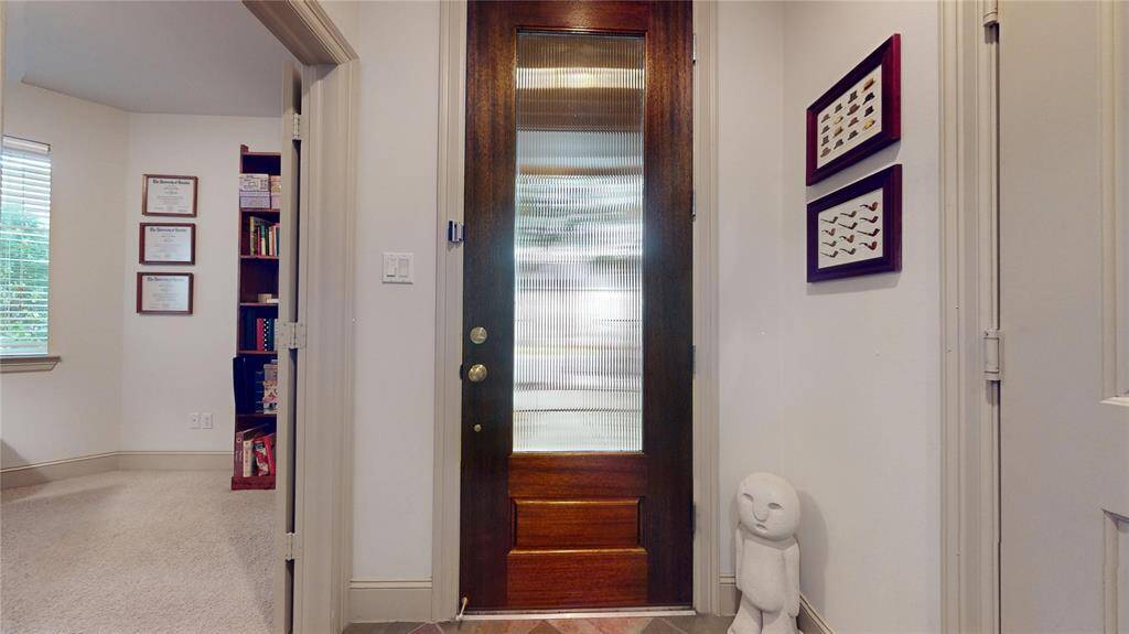 As you enter the large entryway, you will find the first floor bedroom/bath/closet on the right through a set of double doors - perfect for guest room or home office!
