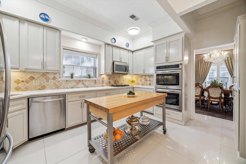 The kitchen has easy access to the dining room, making gatherings more convenient and enjoyable.
