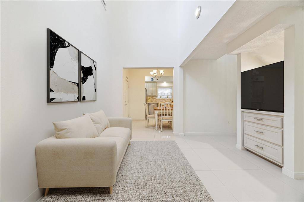 The hallway on the first floor with built-in shelf and drawers. (virtally staged)