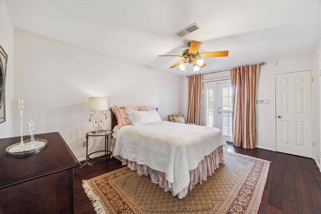 Forth bedroom with a walk-in closet and en-suit bath also has a double French door to the balcony.