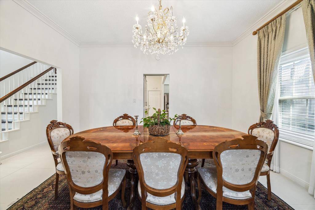 Another view of the dining room with abundant lighting.