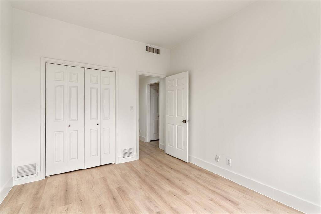 Second bedroom with hanging closet.