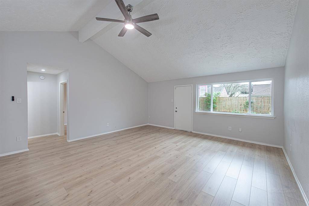 A wall of windows offer views of the glittering pool. At nearly 18x19' there is plenty of space for a sectional or sofa, loveseat, and occassional chairs.