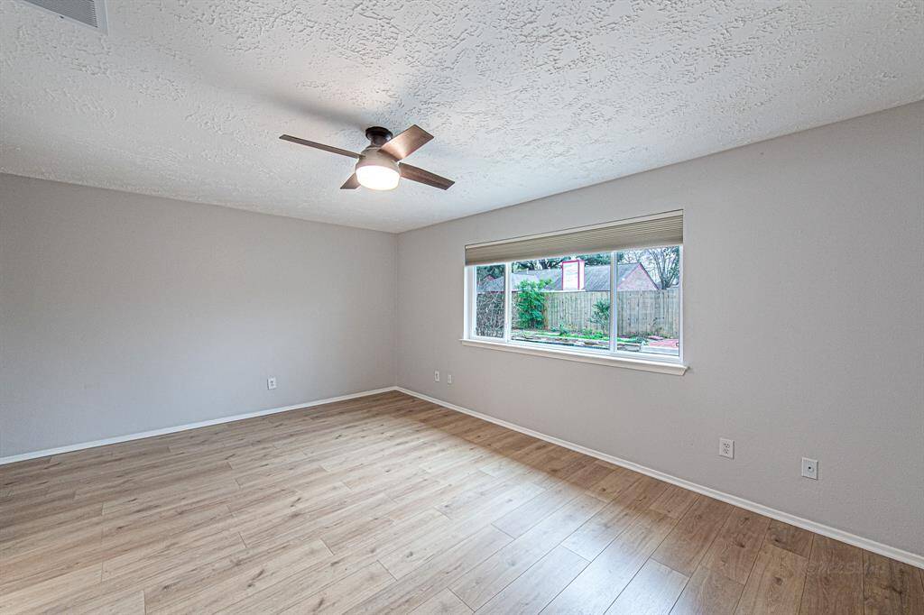 The primary suite is the picture of relaxation and serenity! Luxury vinyl plank floors and soft paint flow through the bedroom.  Double pane windows and ceiling fan keep the living room cool.