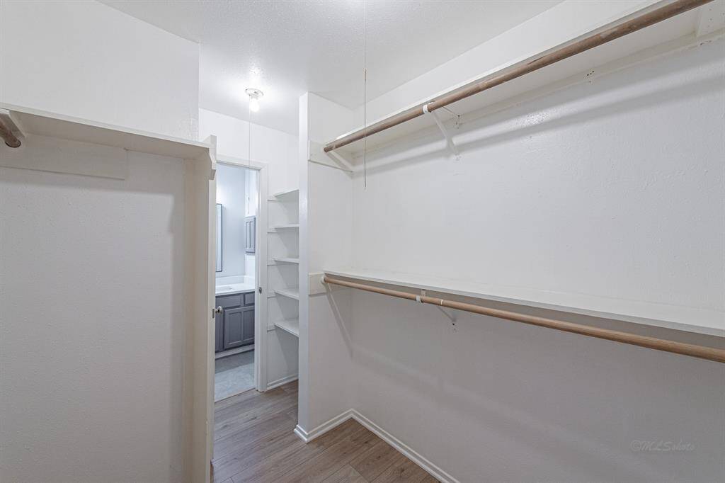 Alternate view of the primary closet highlights the size of the space.