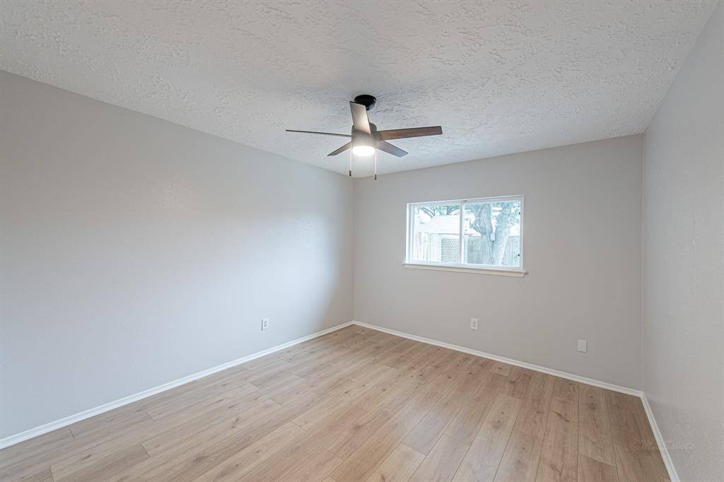 Travel back across the living room to find a passage to 2 secondary bedrooms and a Jack-and-Jill bathroom!  The room features luxury vinyl plank flooring, double pane windows, sleek ceiling fan, and walk-in closet.