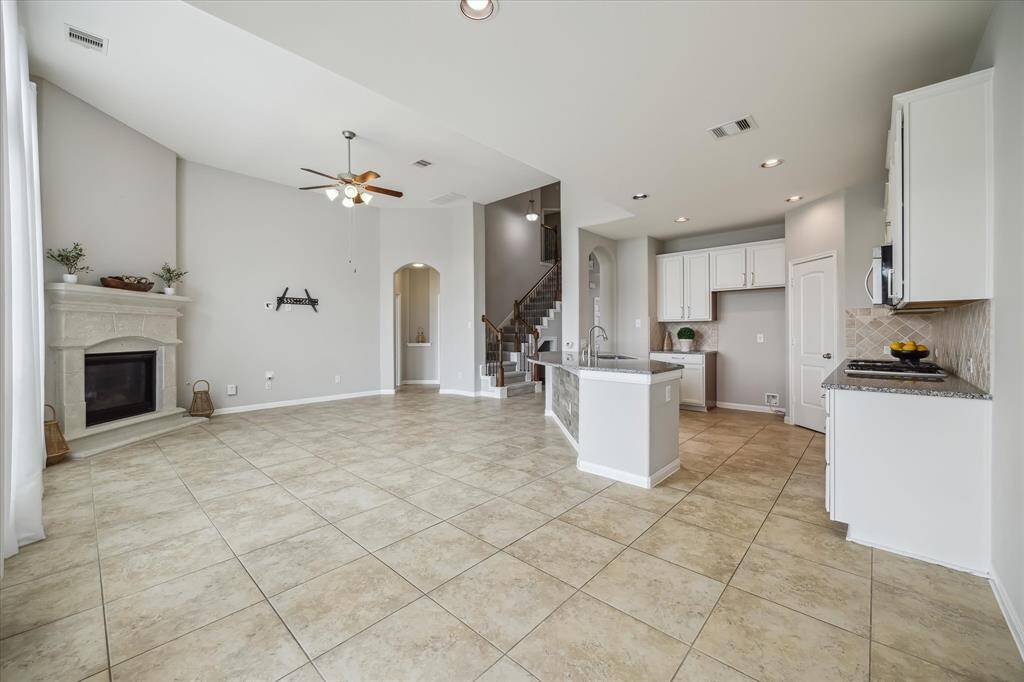 Another view from the breakfast area showing the flow to the kitchen and living areas